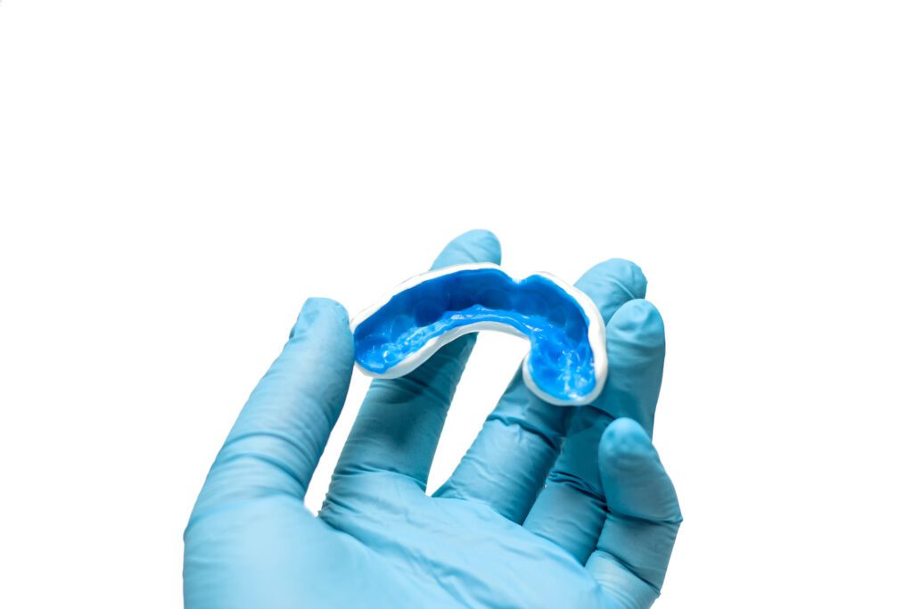 A CUSTOM MOUTHGUARD in Cadillac, MI can help protect your teeth, jaw, and gums